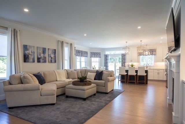 Open-concept first-floor living and dining at Trailside Estates 55+ active adult community in Rochester, MA