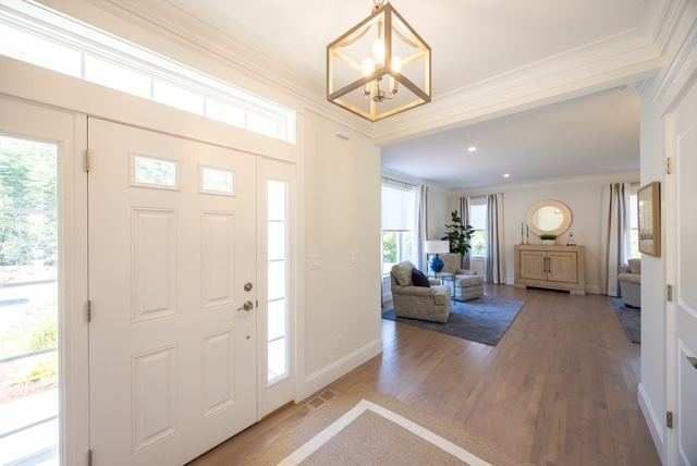 Welcoming foyer of 38 Crestwood Circle, a single-level-living 55+ duplex condominium at Trailside Estates active adult community